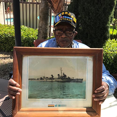 Gardens at Sierra resident and Korean War veteran, Sam, displays a rendering of the ship he served on.